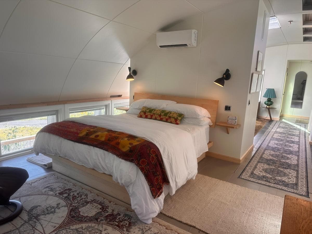 California king bed with extra blankets underneath