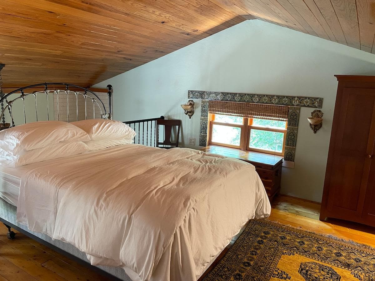 Queen-sized bed with luxury bedding